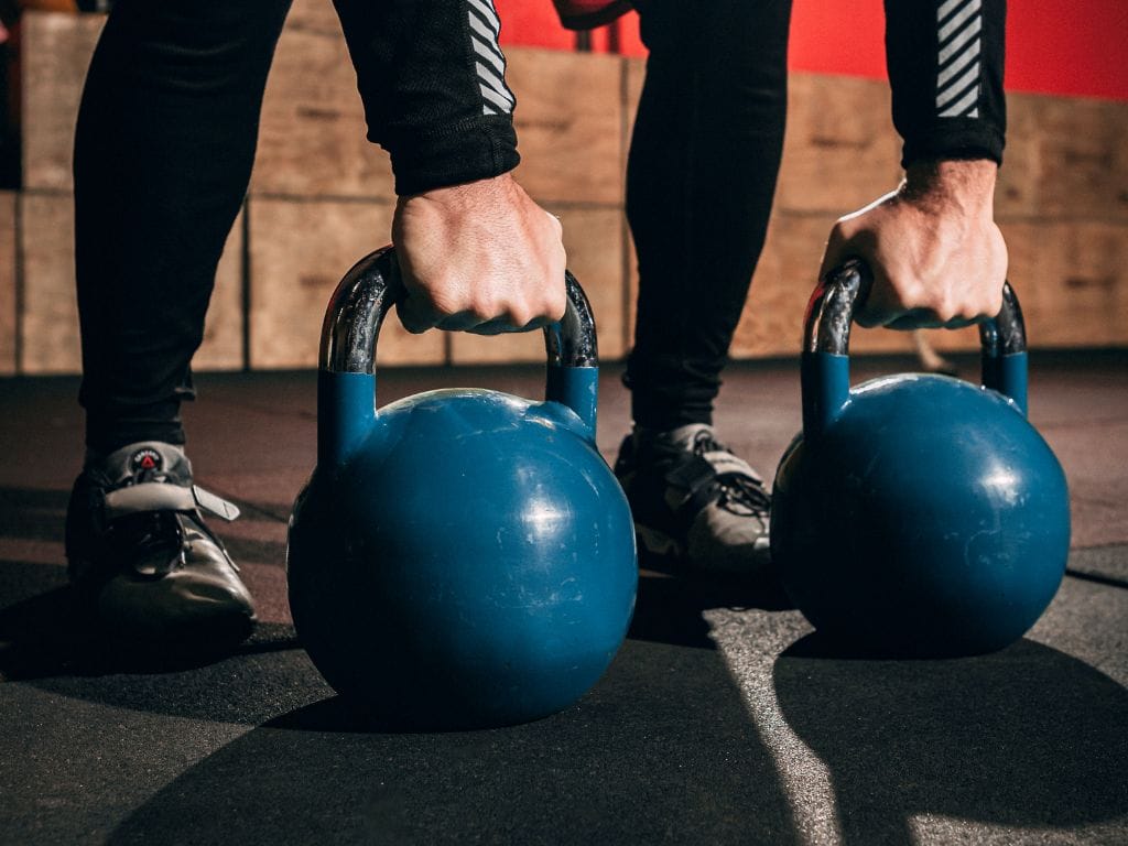 kettlebells vs dumbbells pros cons