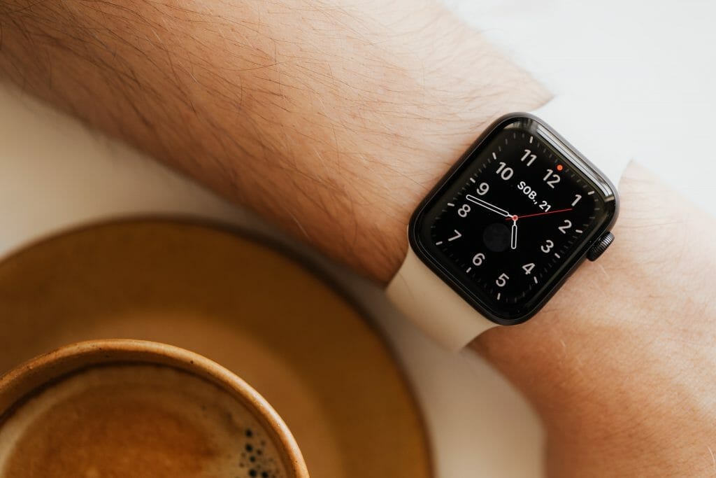 Faceless man wearing smart watch and drink coffee