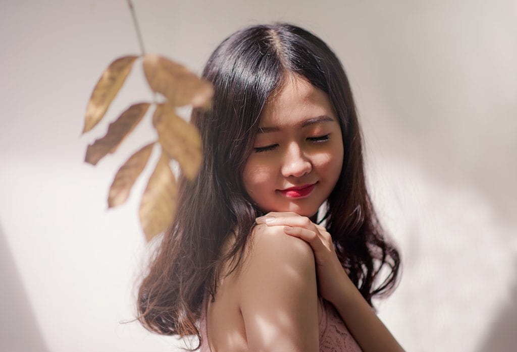 Woman wearing brown sleeveless top